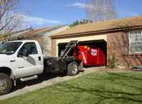roll-off dumpster rental in denver garage driveway