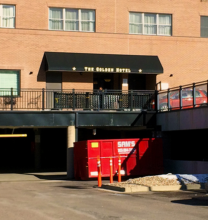 Sam's Hauling dumpster at the Golden Hotel